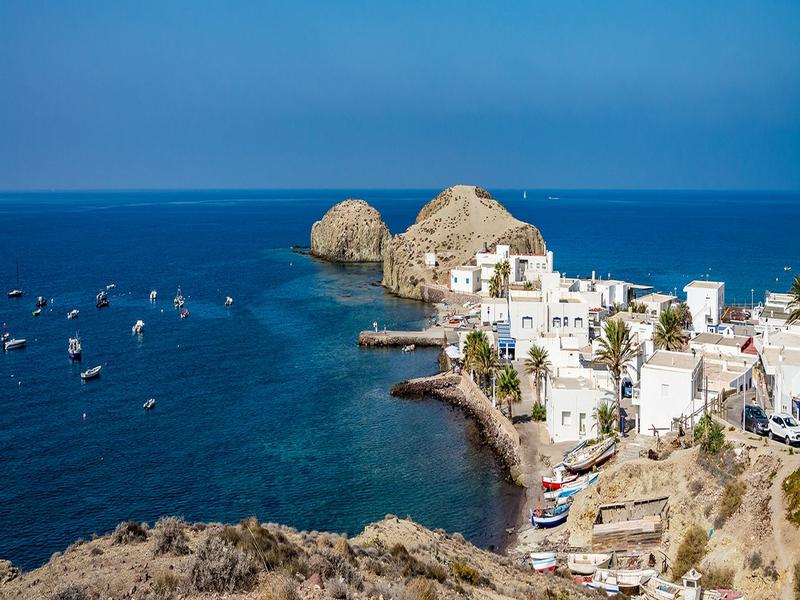 Turquoise cove and whitewashed fishing village on the Almería coast | Andaluciatours