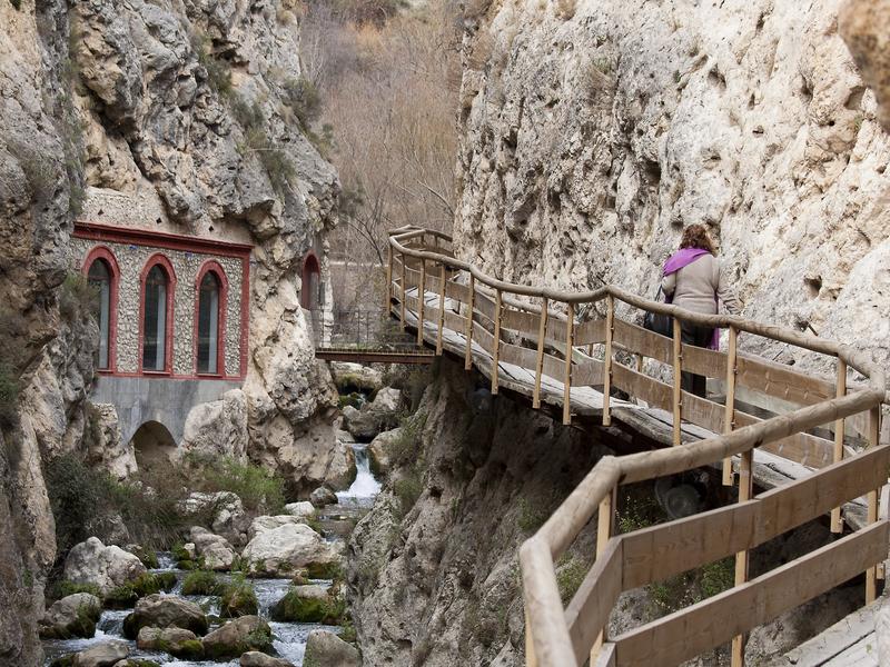 A wooden walkway threading a rocky gorge in the Huéscar highlands, Granada — adventure with Andaluciatours.