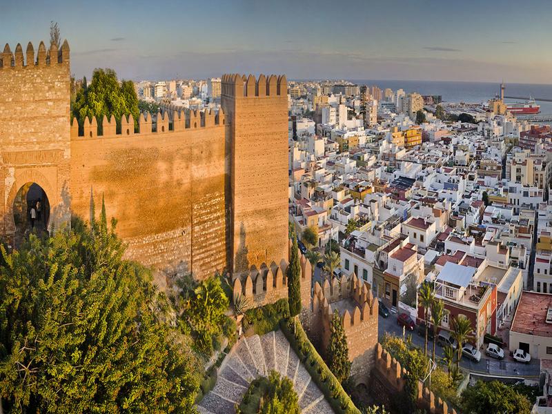 The mighty Alcazaba fortress above the white city and port of Almería — explore the Almería metropolitan area with Andaluciatours.