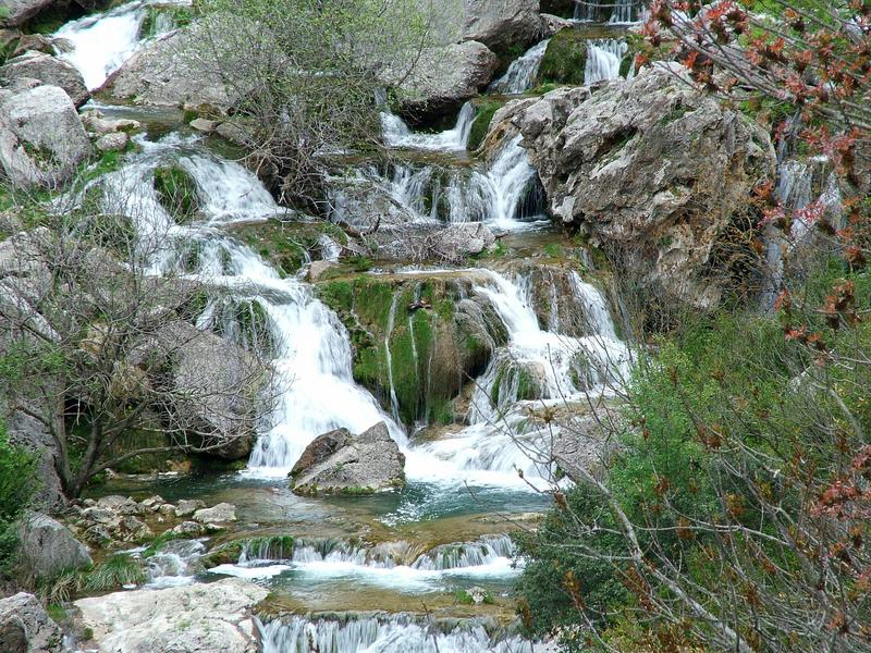 A mountain stream tumbling over limestone rocks in the Sierra de Segura, Jaén — discover its wild nature with Andaluciatours.