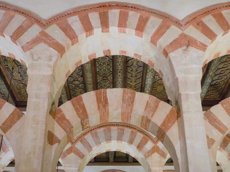 Red-and-white striped arches inside the Mosque-Cathedral of Córdoba | Andaluciatours