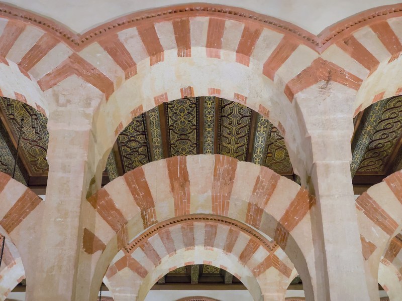 Red-and-white striped arches inside the Mosque-Cathedral of Córdoba, Andalusia, Spain