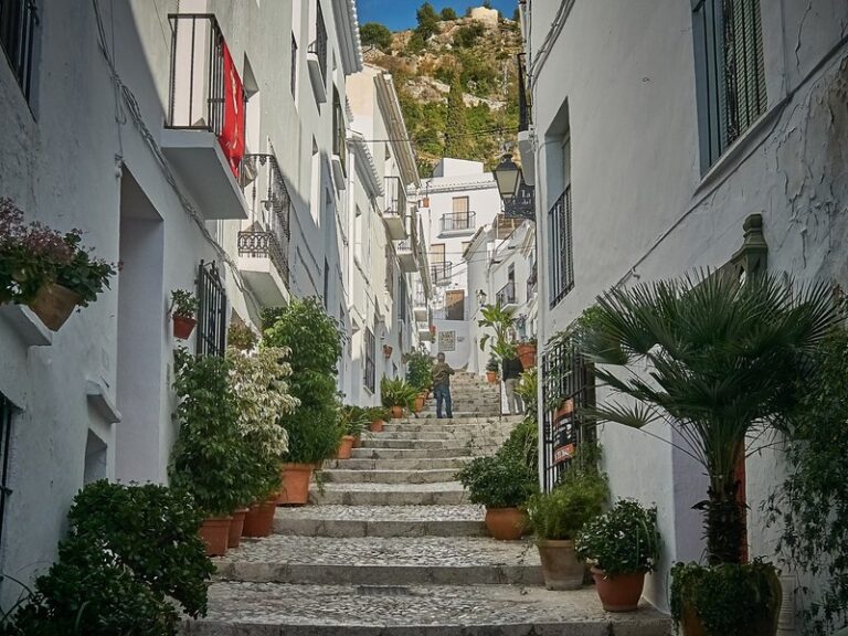 Whitewashed, flower-lined street in Frigiliana on the Costa del Sol | Andaluciatours